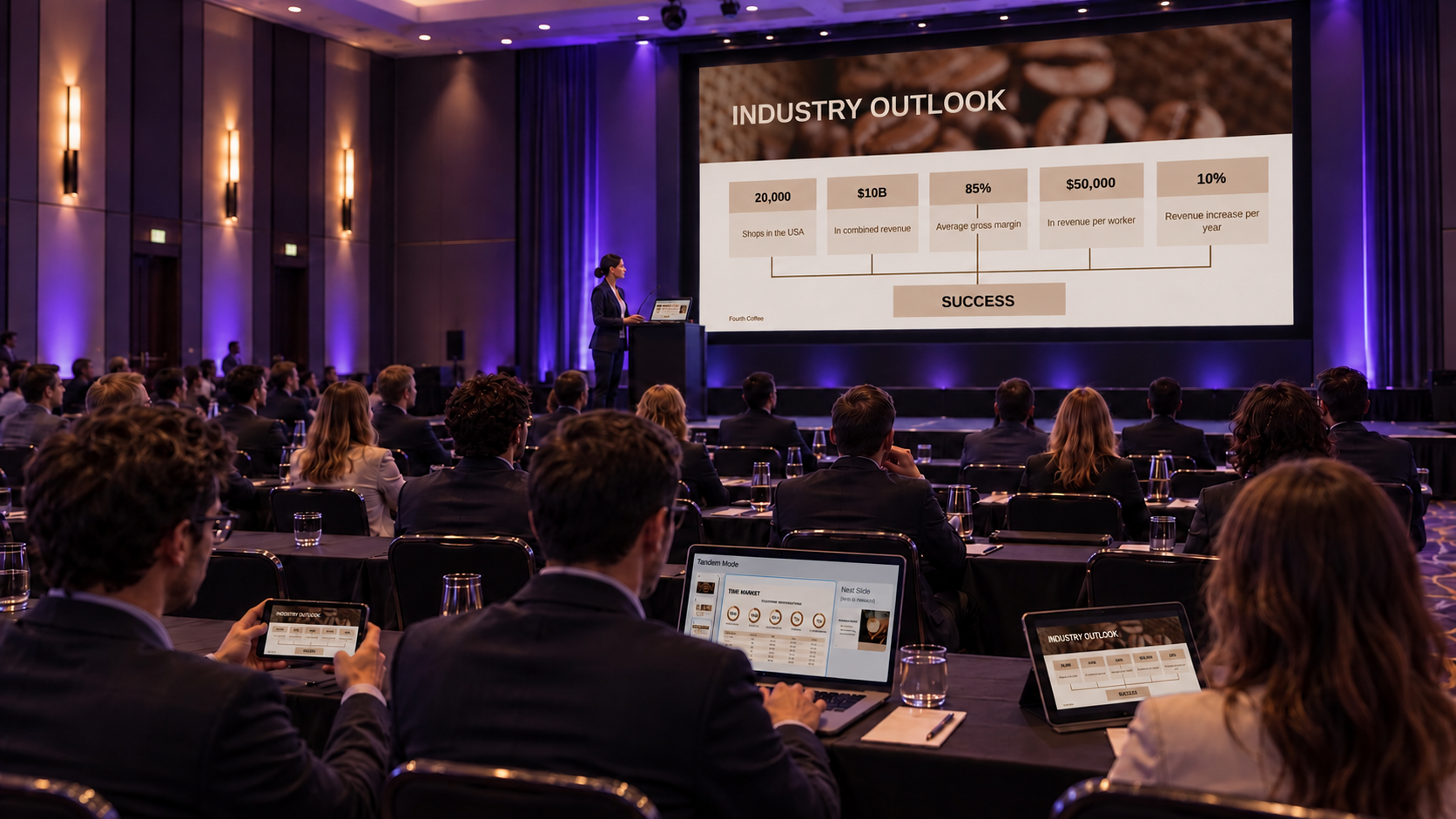 A presenter shares the coffee-industry presentation on a conference-hall screen while attendees follow on a phone, laptop and tablet.